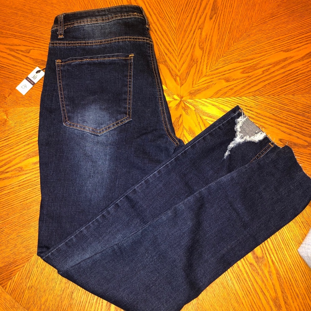 Distressed mid rise skinny jeans